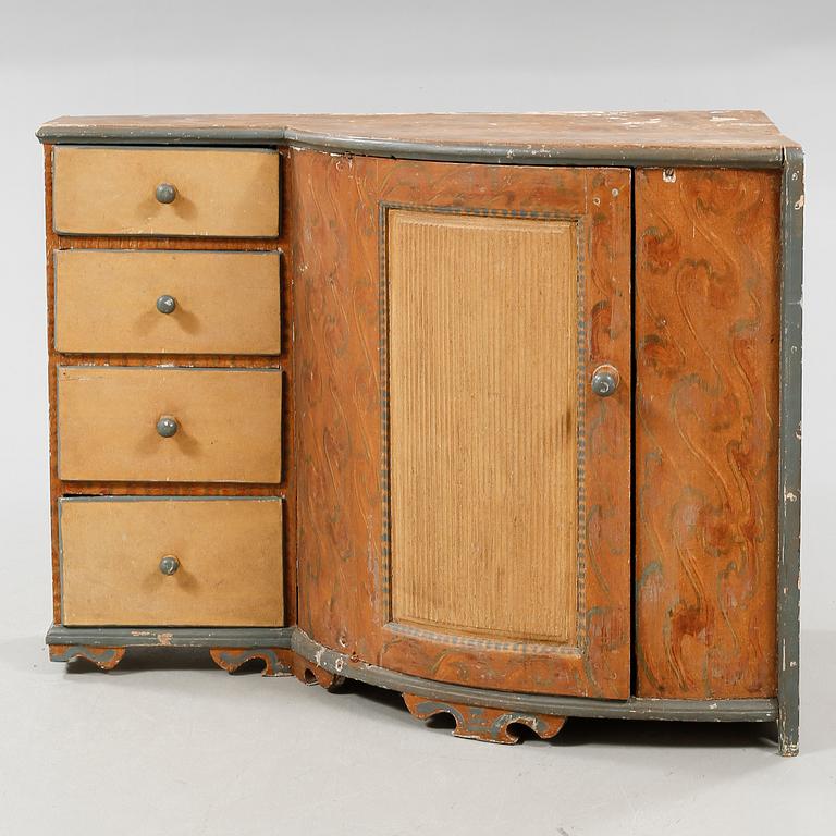 An 19th century corner cupboard.