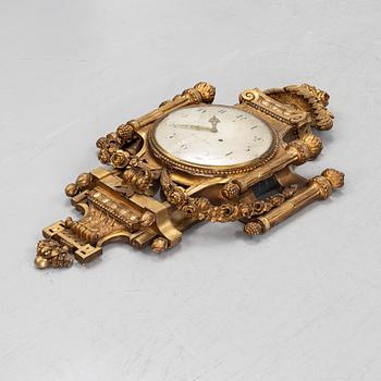 A Gustavian giltwood and parcel-gitl cartel clock by Per Henrik Beurling (Stockholm 1783-1806).