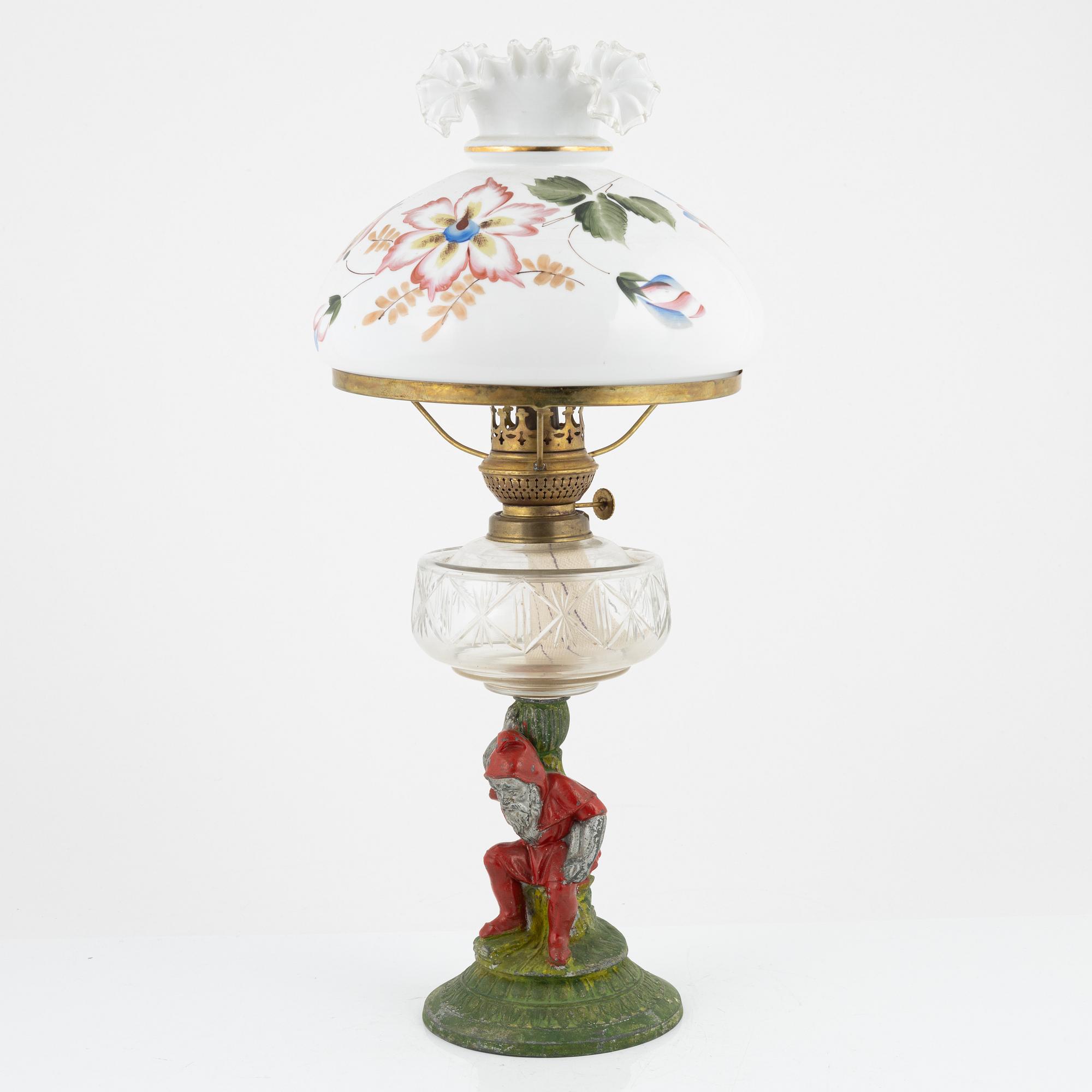 A early 20th century glass kerosene lamp.