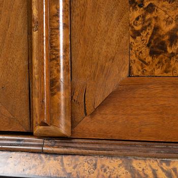 A burr alder, elm, and gilt-brass mounted late Baroque cabinet, first part of the 18th century.