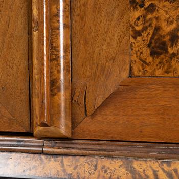 A burr alder, elm, and gilt-brass mounted late Baroque cabinet, first part of the 18th century.