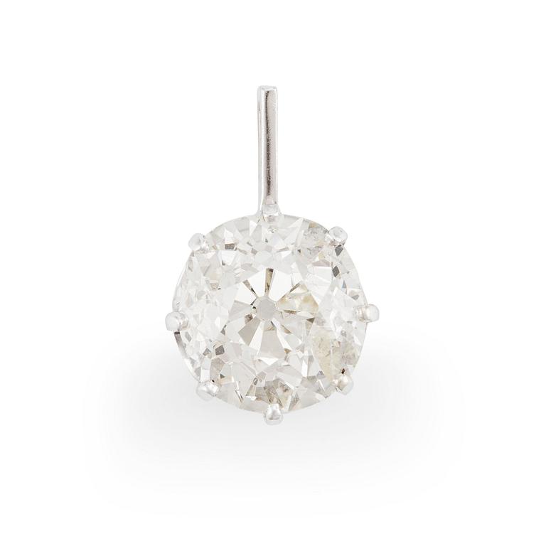 An 18K gold pendant with an old-cut diamond.