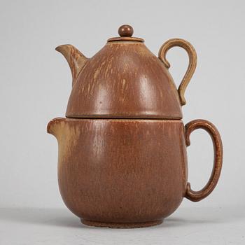 Tea pot, two bowls, two creamers, and a vase by Gunnar Nylund, stoneware, Rörstrand.