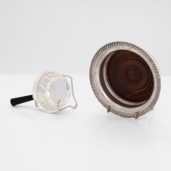 Two miniature beakers and a butter pan, Copenhagen, 1950s, and a silver-plated bottle coaster.