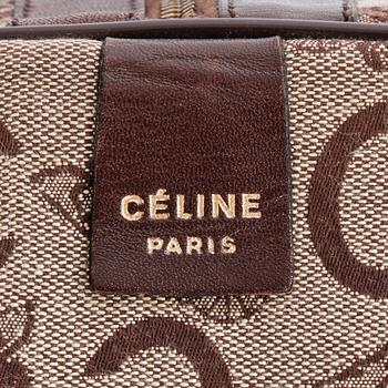 CÉLINE, a monogram canvas weekend bag.