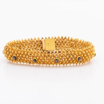 ARMBAND 14K guld, 35,1 g. bruna cabochonslipade stenar, ca 19 x 1,5 cm.