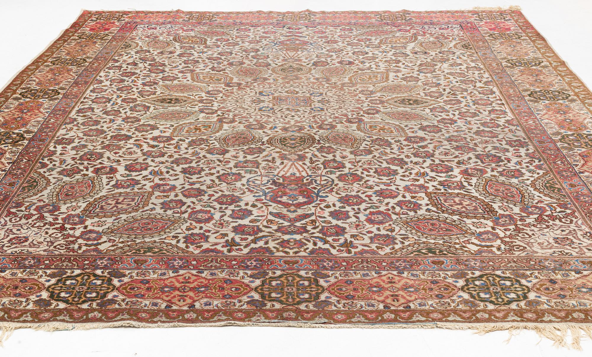 A Tabriz carpet, c. 390 x 305 cm.