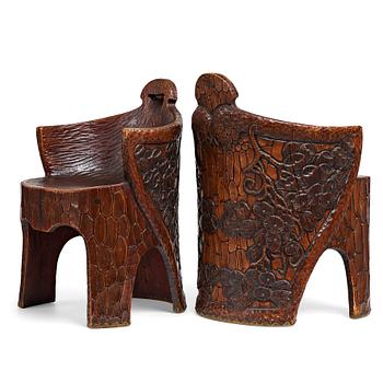 235. Gustaf Fjaestad, a pair of Art Nouveau carved pine chairs "stabbestolar", Arvika Sweden 1908-09.