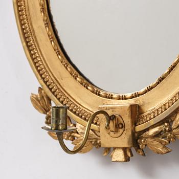 A pair of late Gustavian giltwood one light girandoles, Stockholm, circa 1800.