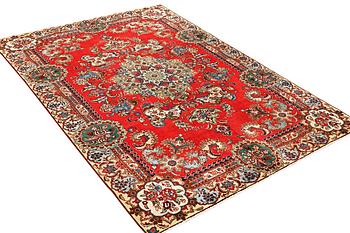 A carpet, Tabriz, c. 318 x 211 cm.