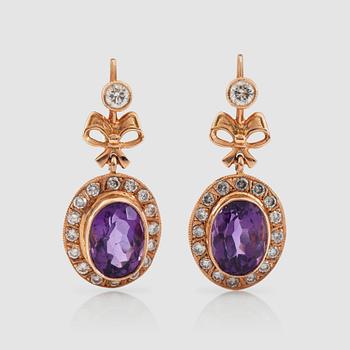 1374. A pair of amethyst and brilliant-cut diamond earrings. Total carat weight of diamonds circa 1.33 cts.
