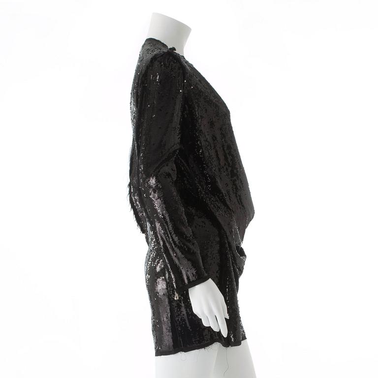 BALMAIN, a black sequin dress.