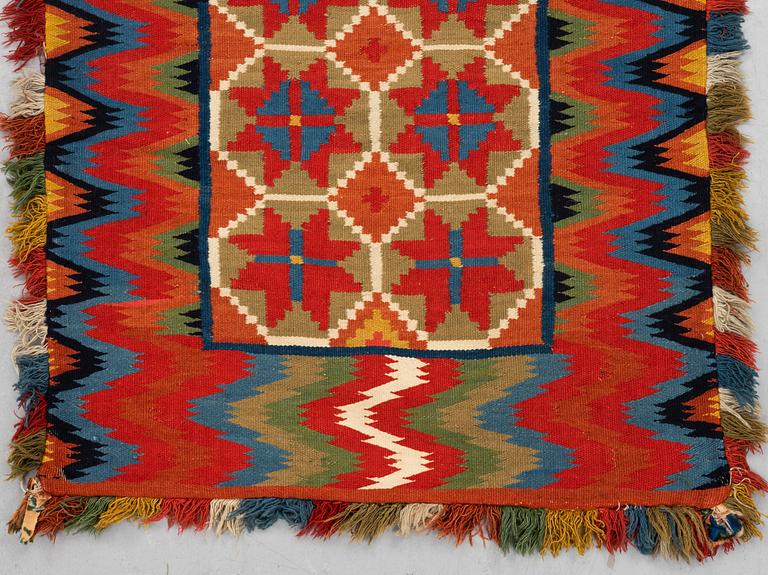 A carriage cushion, double-interlocked tapestry, ca 109,5 x 46 cm, Scania, Sweden.