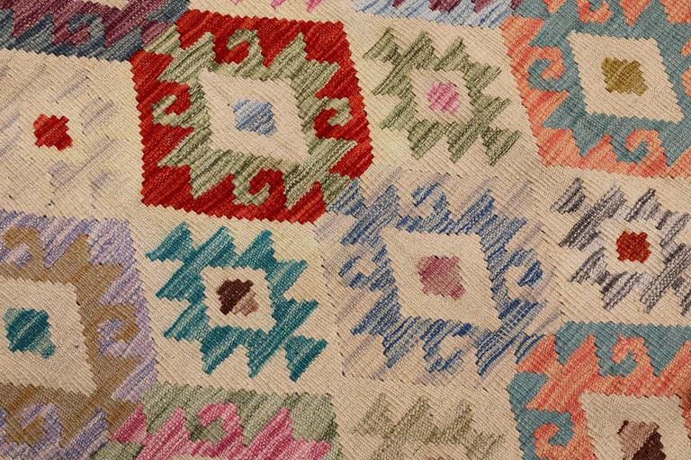 A Kilim rug, approx. 297 x 248 cm.