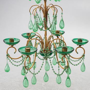 A chandelier, likely from Italy, circa 1950.