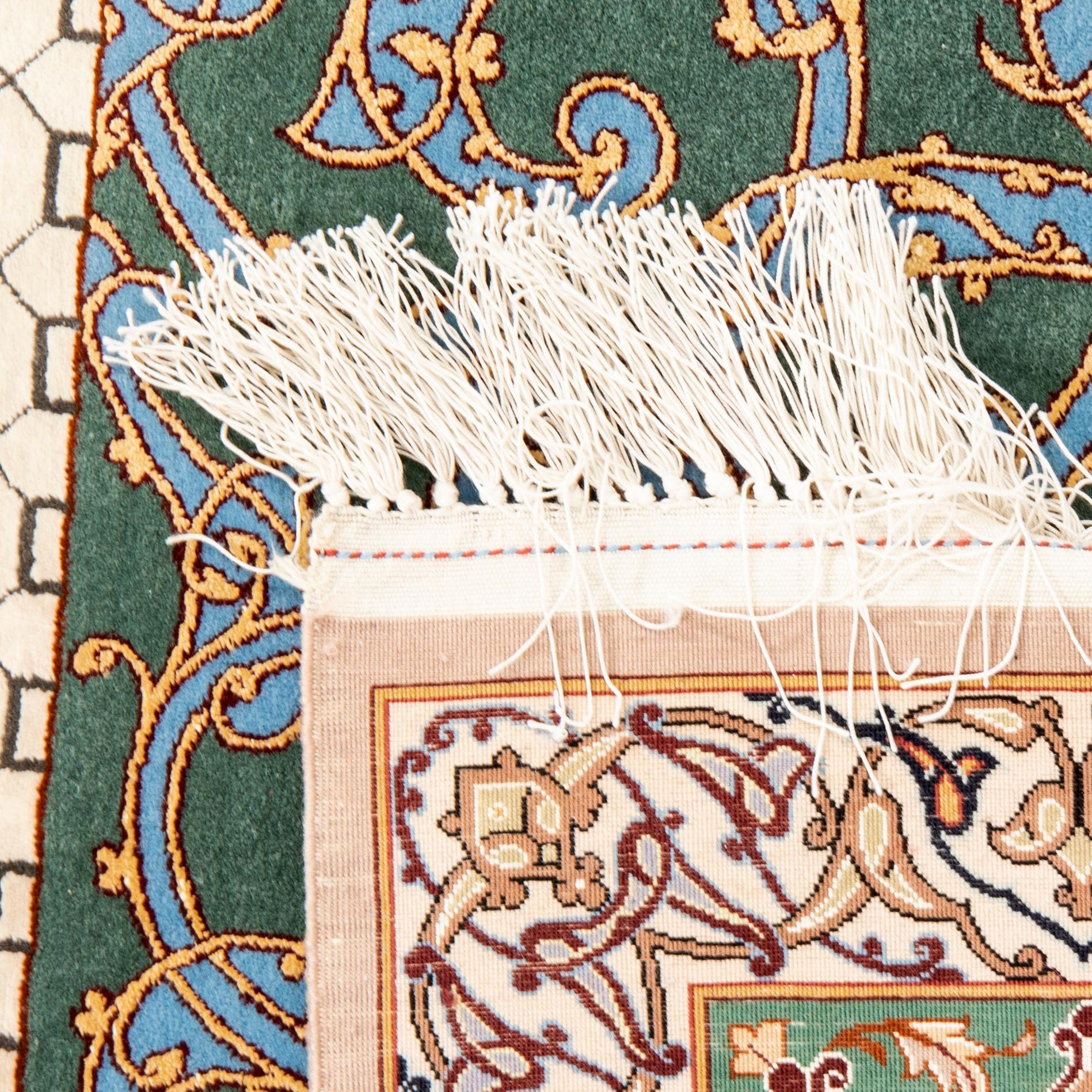 An old Isfahan carpet signed approx 240x174 cm.