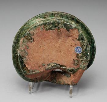 A green glazed heart shaped pigsty with pig, Han dynasty (206 BC- 220 AD).