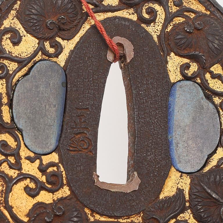 Five tsubas, 18/19th Century, one signed.