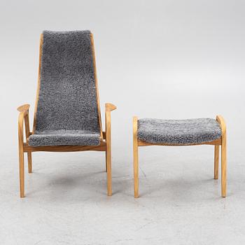 An Yngve Ekström armchair with footstool, "Lamino", Swedese, 21st century.