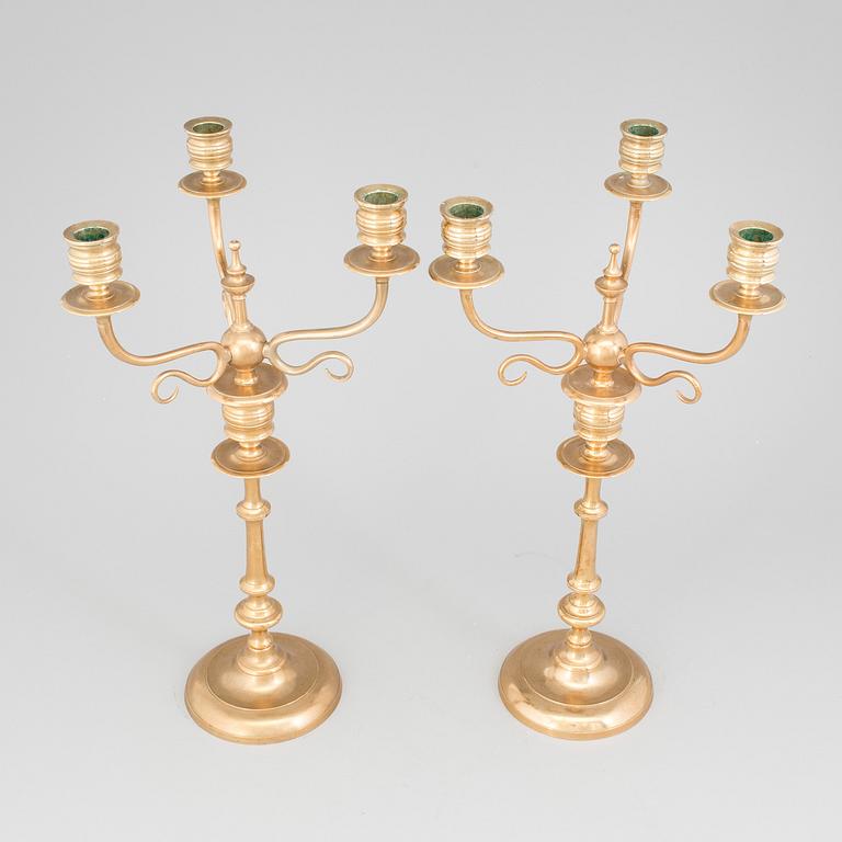 A pair of Candelabra, in brass Westerås Metallfabriks AB, late 19th century.