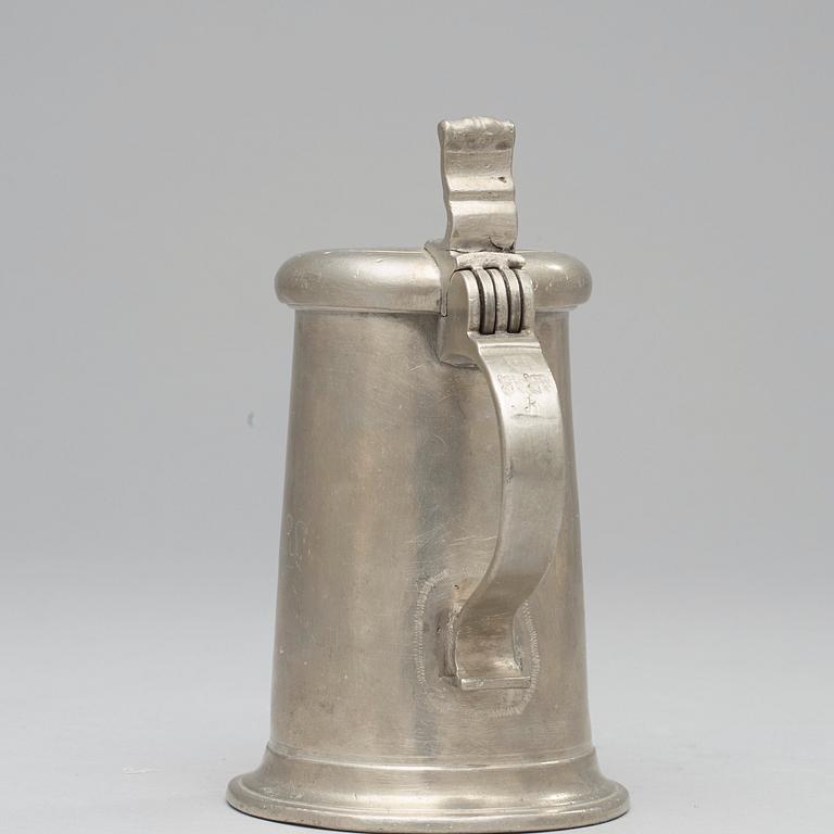 A pewter jug by J Ch Pohlitz 1727.