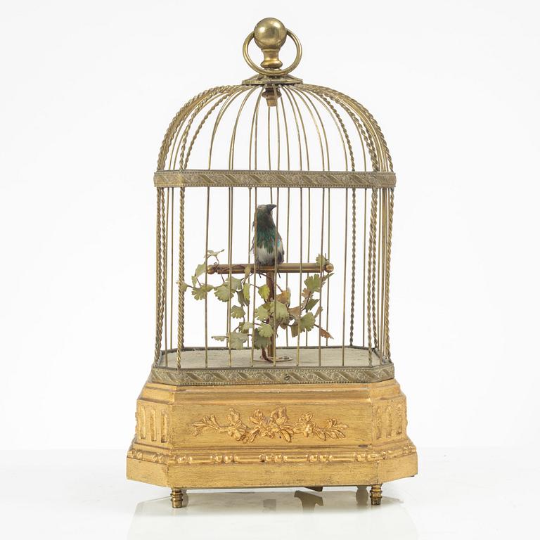 A music box in the shape of a bird's cage, France, late 19th century.