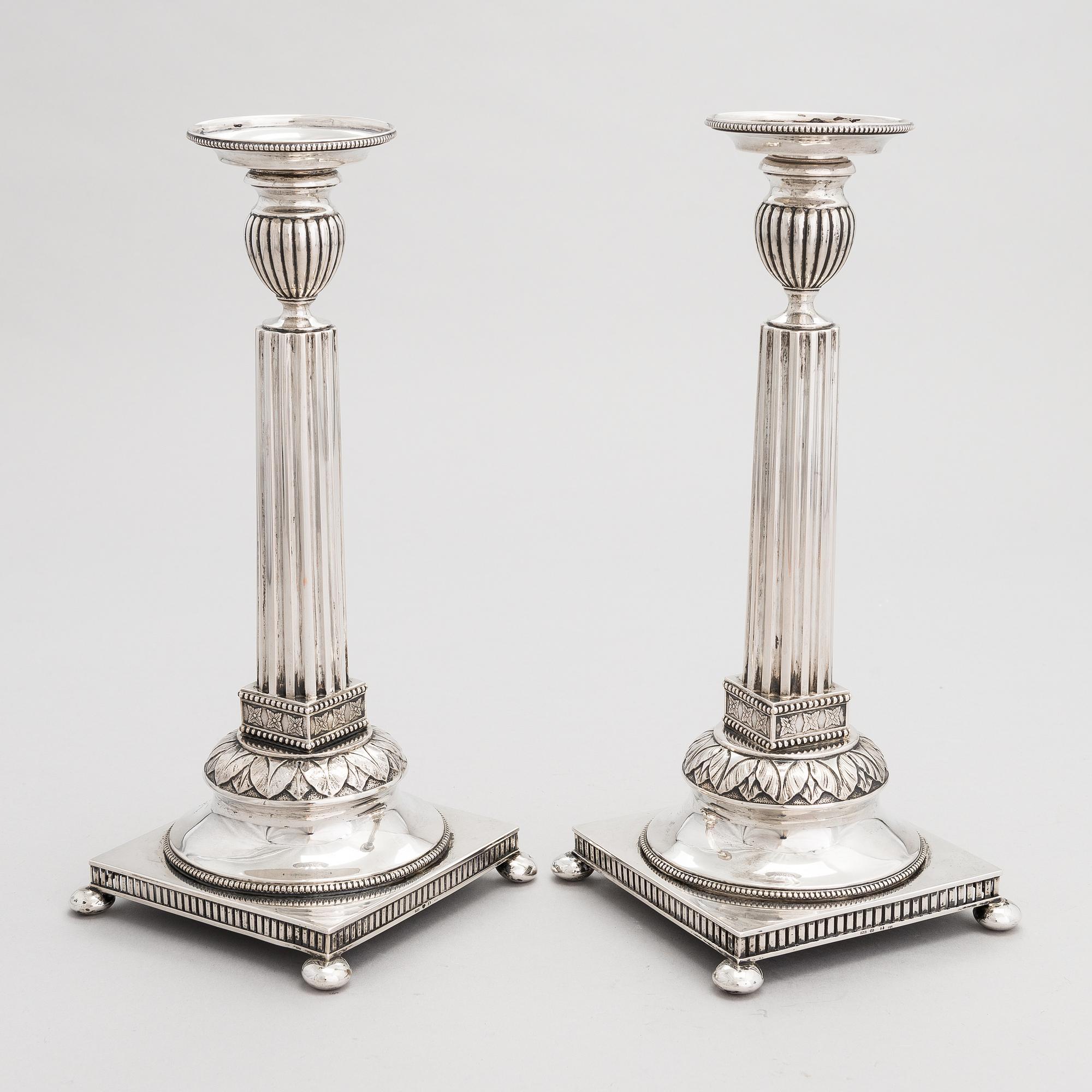 A pair of Swedish silver candlesticks, CG Hallberg, Stockholm 1901 and 1902.