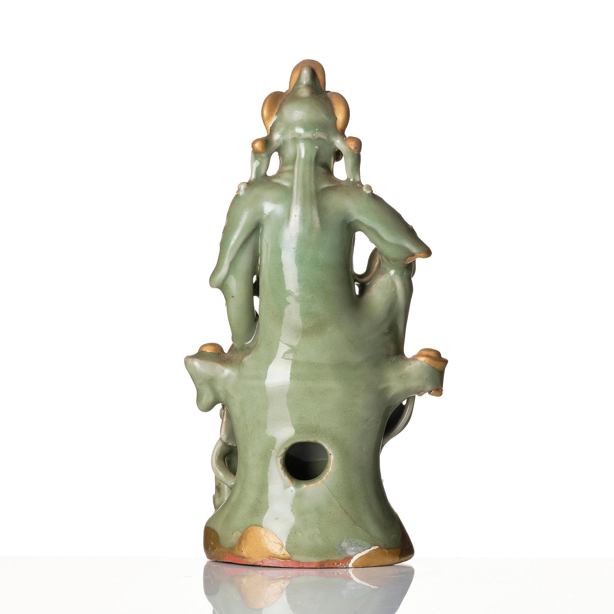 A celadon glazed figure of Guanyin, Ming dynasty (1368-1644).