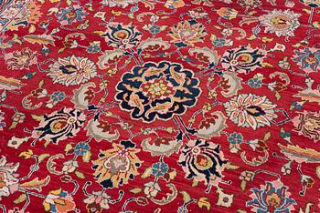 A semi-antique Tabriz carpet, c 358 x 248 cm.