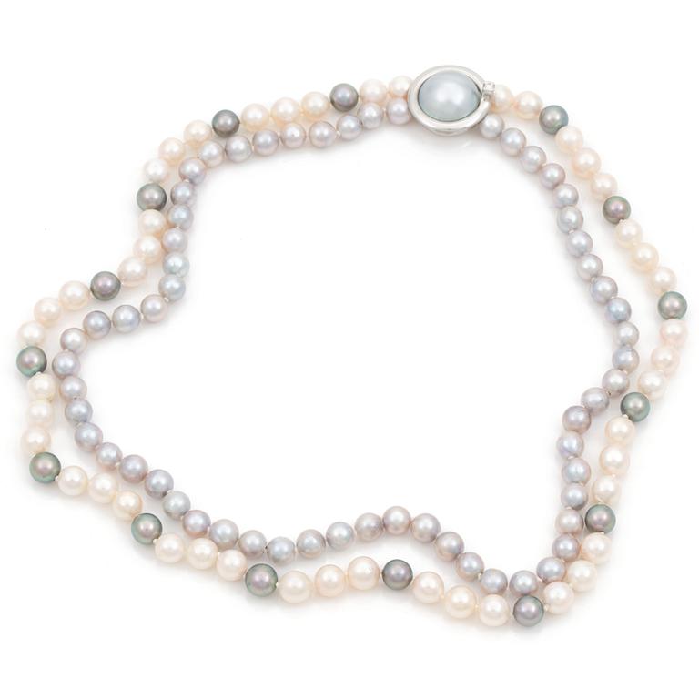 A Ole Lynggaard cultured freshwater pearl necklace. Clasp set with a cultured mabé pearl and a brilliant cut diamond.