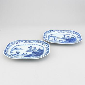 A set of two blue and white serving dishes, and two famille rose dinner plates, Qing dynasty, Qianlong (1736-95).