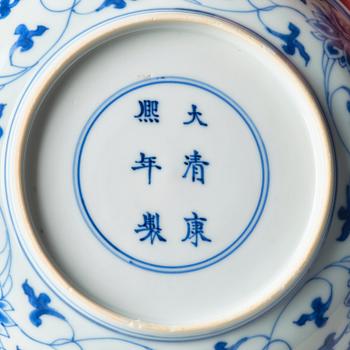 A blue and white lotus dish, Qing dynasty, Kangxi six character mark and of the period (1662-1722).