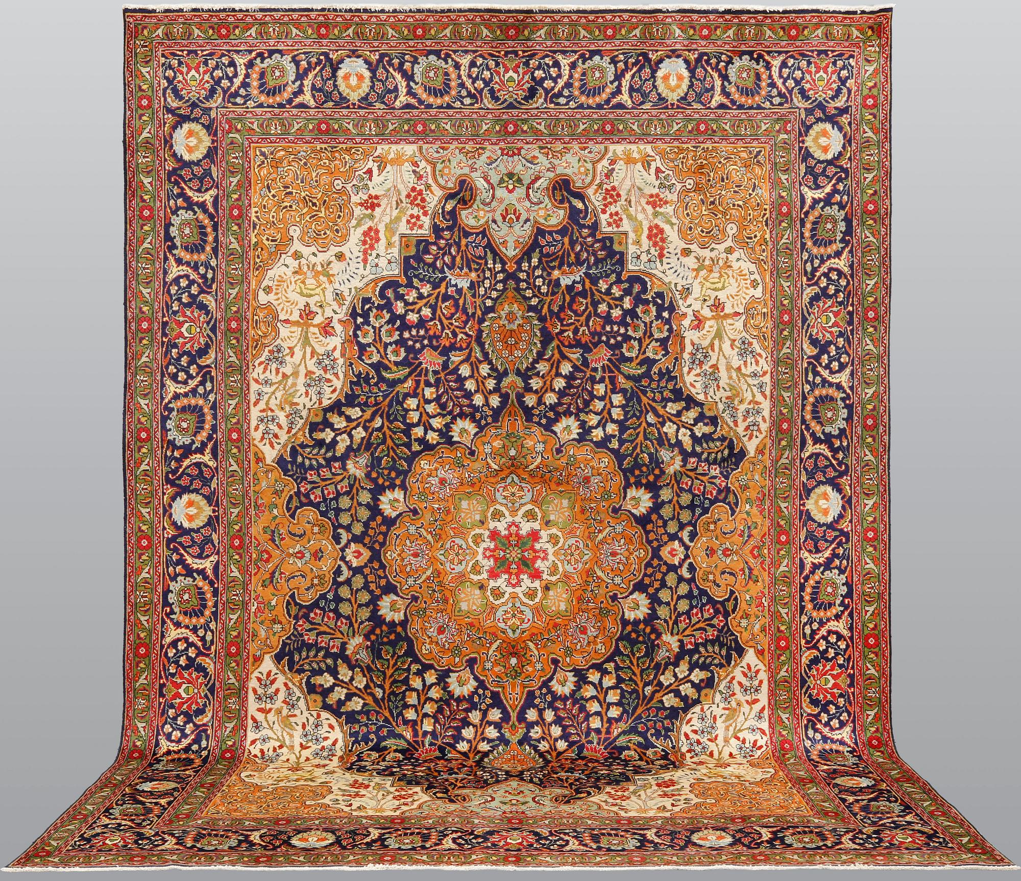 A pictoral Tabriz carpet, ca 403 x 282 cm.