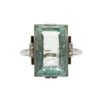 A RING, 18K white gold. Aquamarine c. 8.60 ct, rose cut diamonds. Stockholm 1936. Size 18+. Weight 4,9 g.
