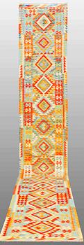 A Kilim carpet, ca 519 x 81 cm.