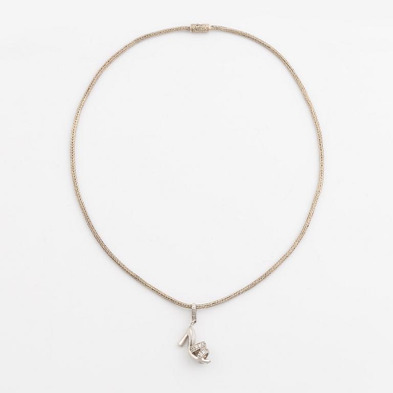 18K white gold shoe pendant with faceted white stones, silver chain.