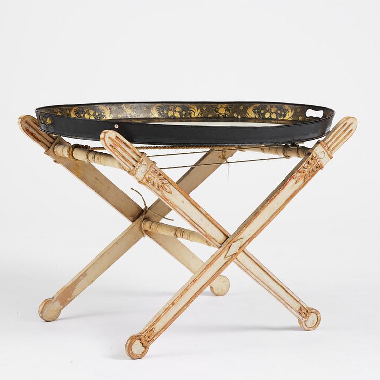 A tole-peinte Empire tray, first part 19th century on a later stand.