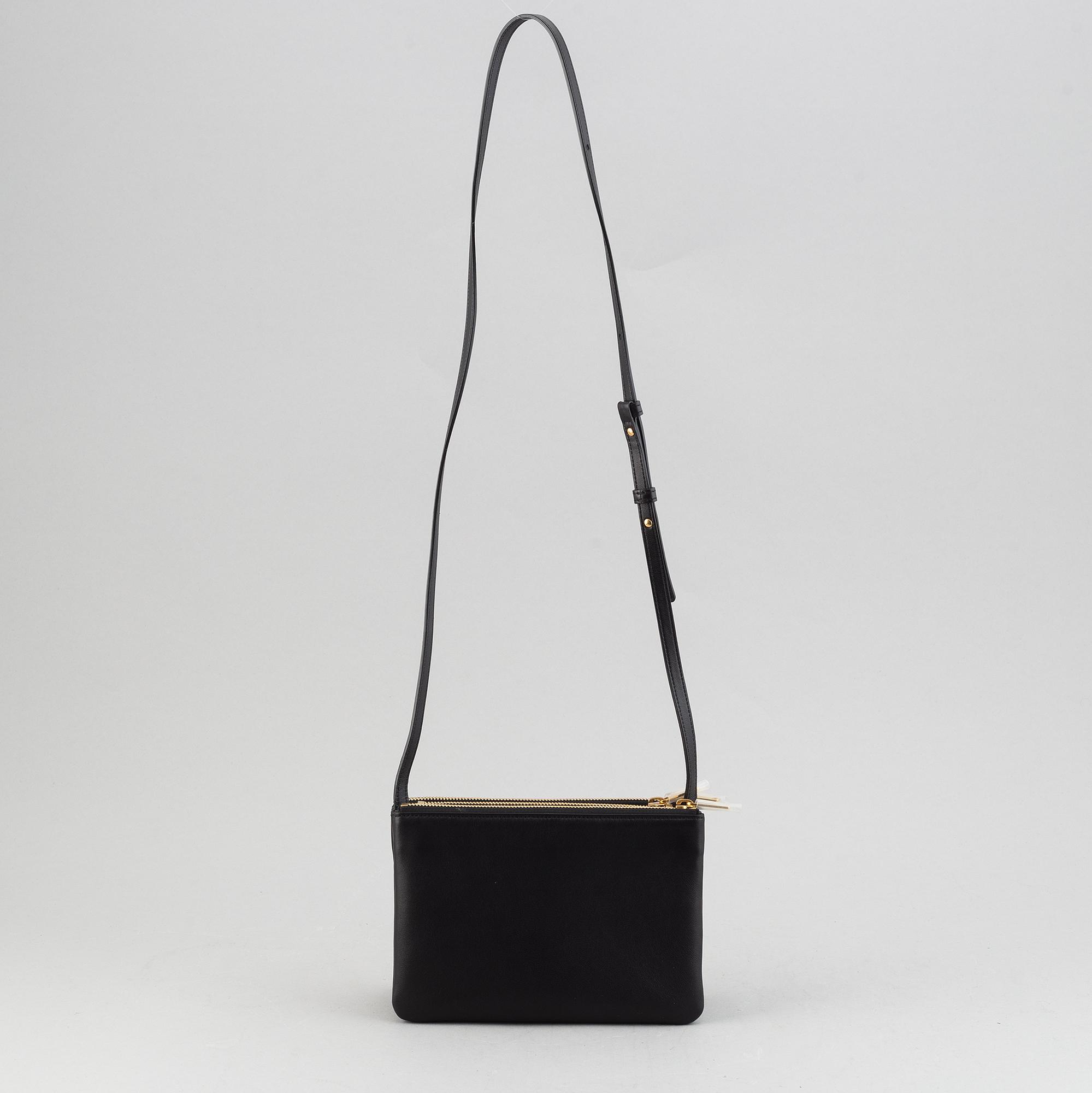 Céline, a black leather 'Trio Bag'.