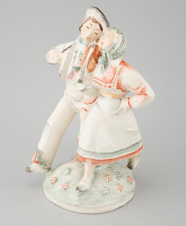 An earthenware figurine signed by Löfman.