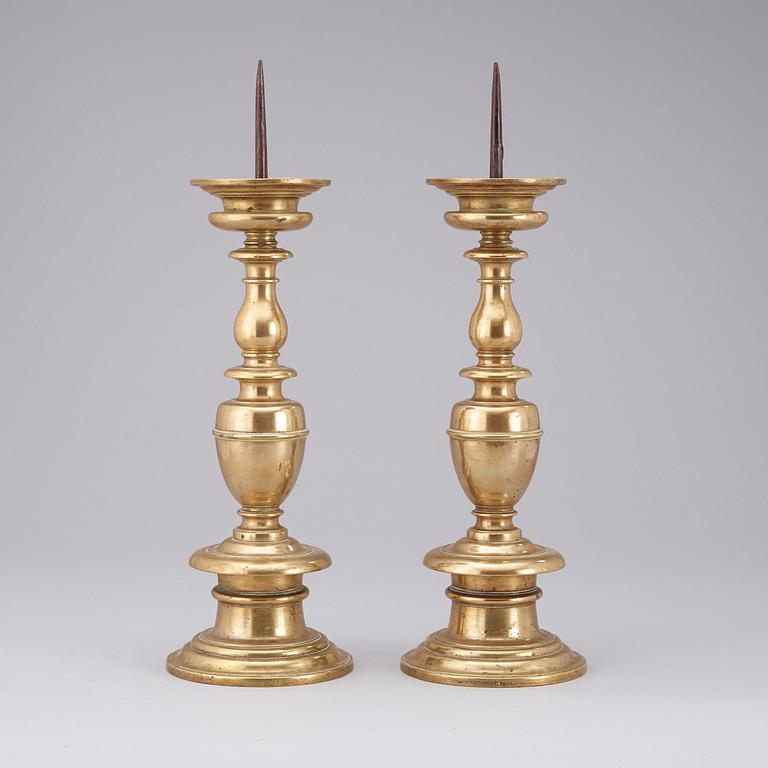 A pair of Baroque 16/17th century brass pricket candlesticks.