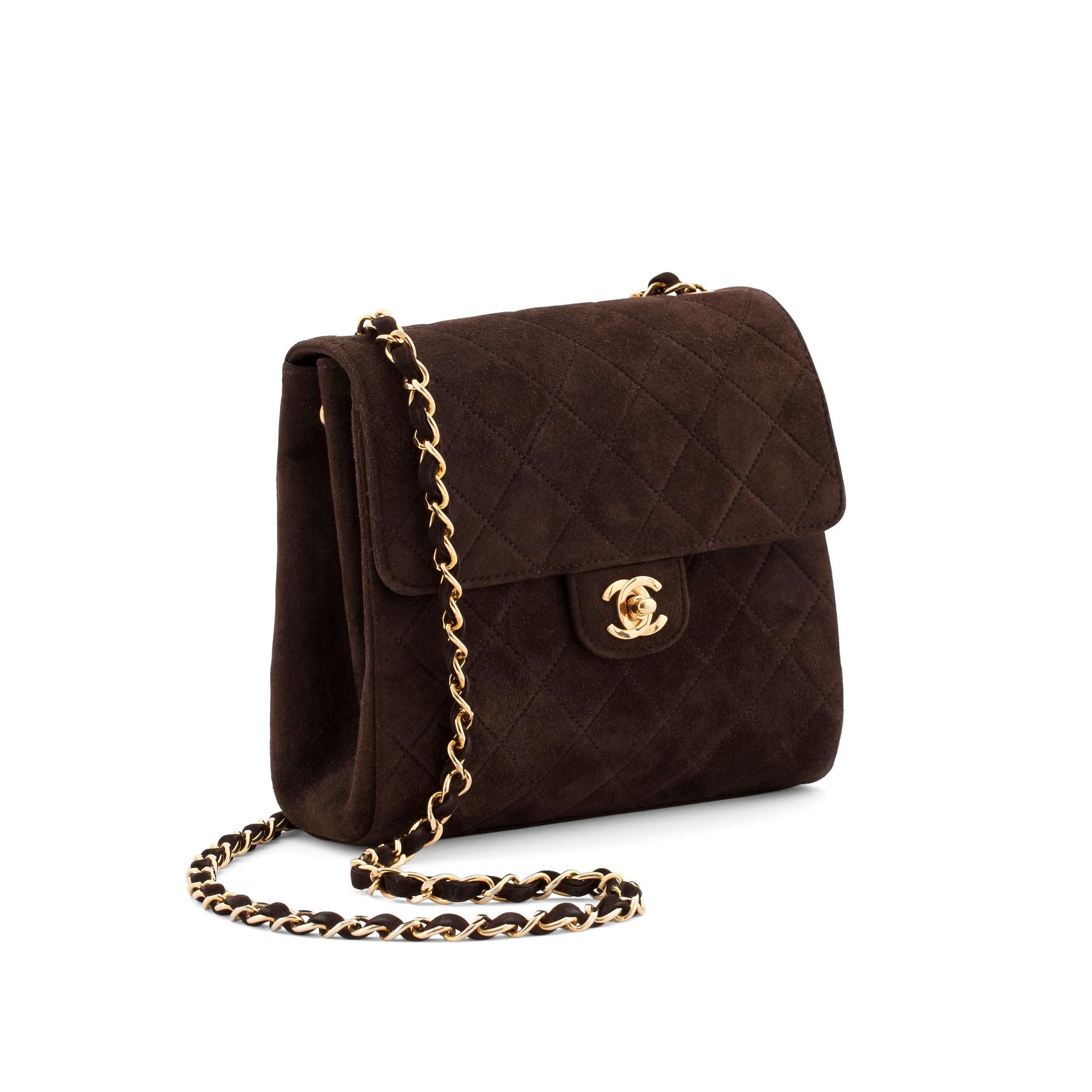 CHANEL, a brown suede shoulderpurse.