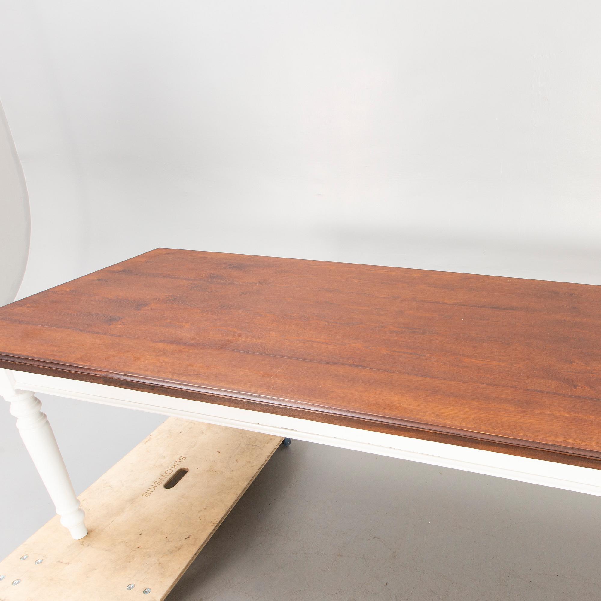 A painted and stained table 21st century.