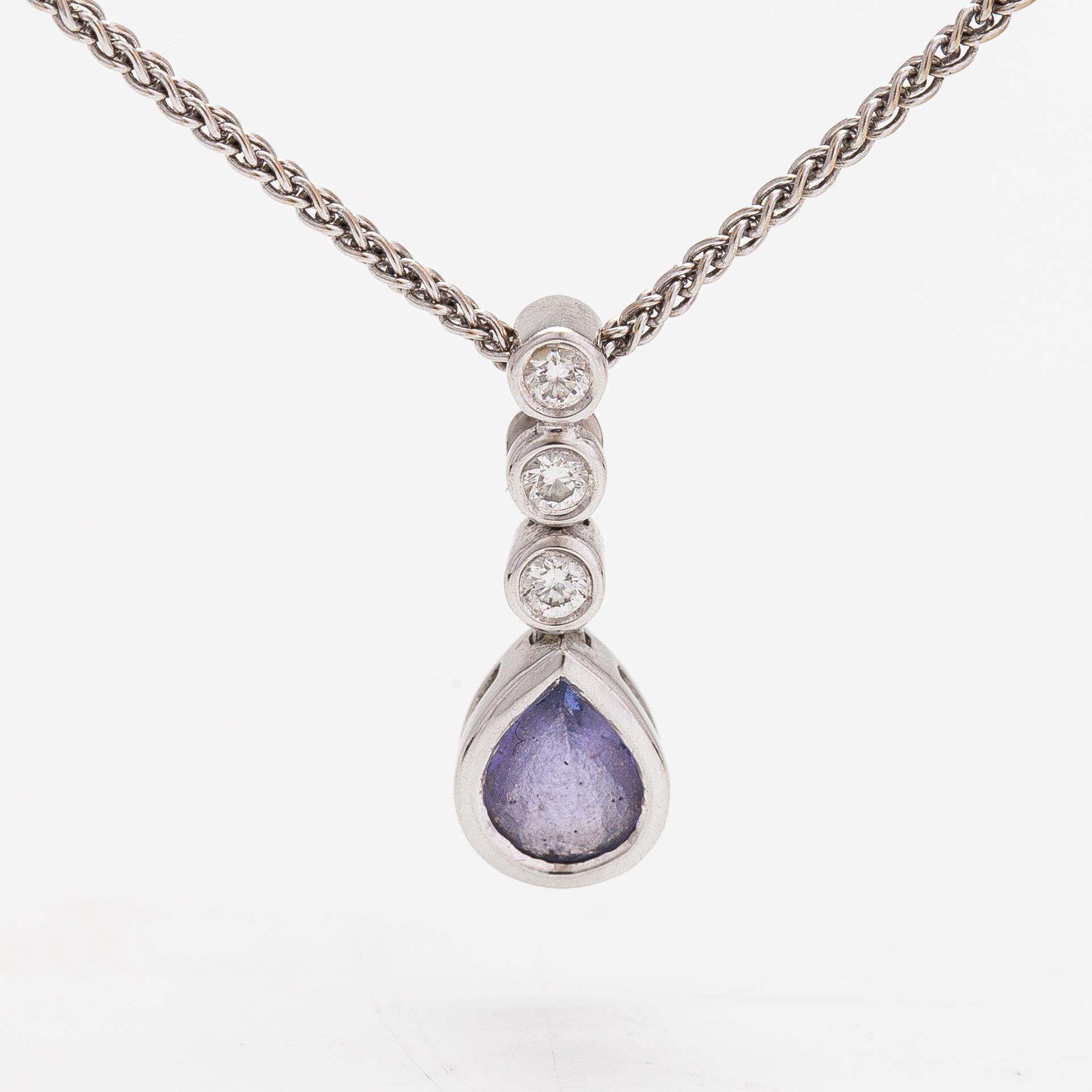 An 18K white gold necklace with a tanzanite and diamonds ca. 0.06 ct in total.