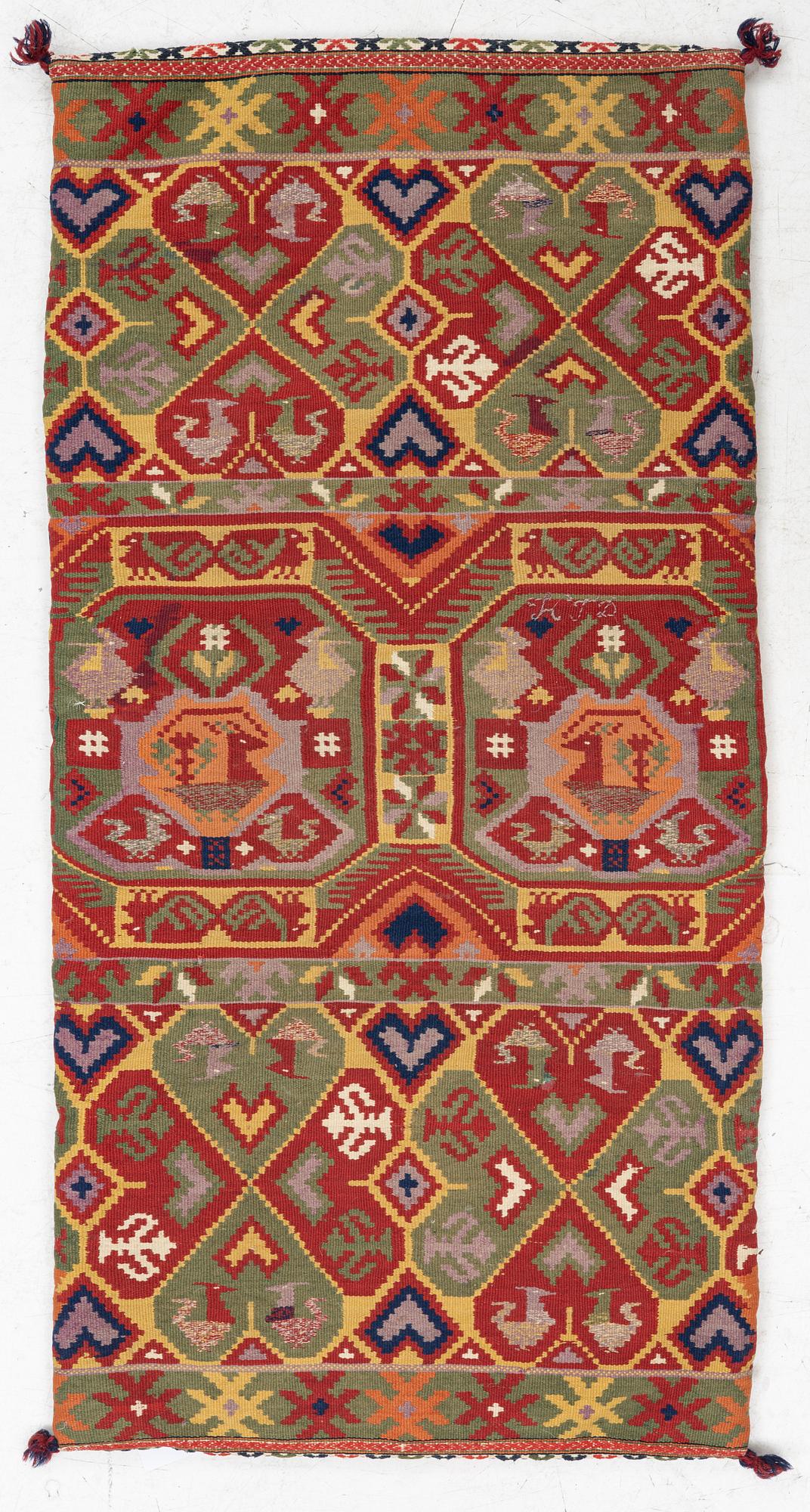 A double-interlocked tapestry carrige cushion, c 100 x 50 cm, Scania, mid 19th century.