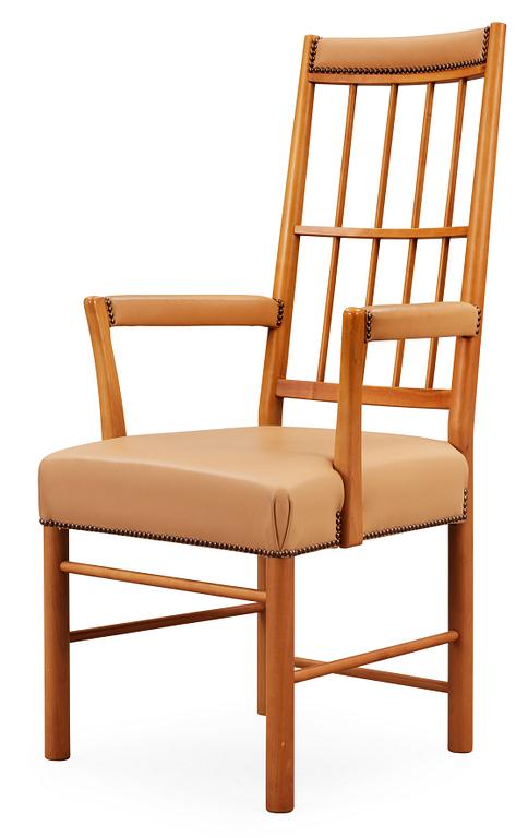 A Josef Frank cherry and beige leather armchair, Svenskt Tenn 2007, model 652.