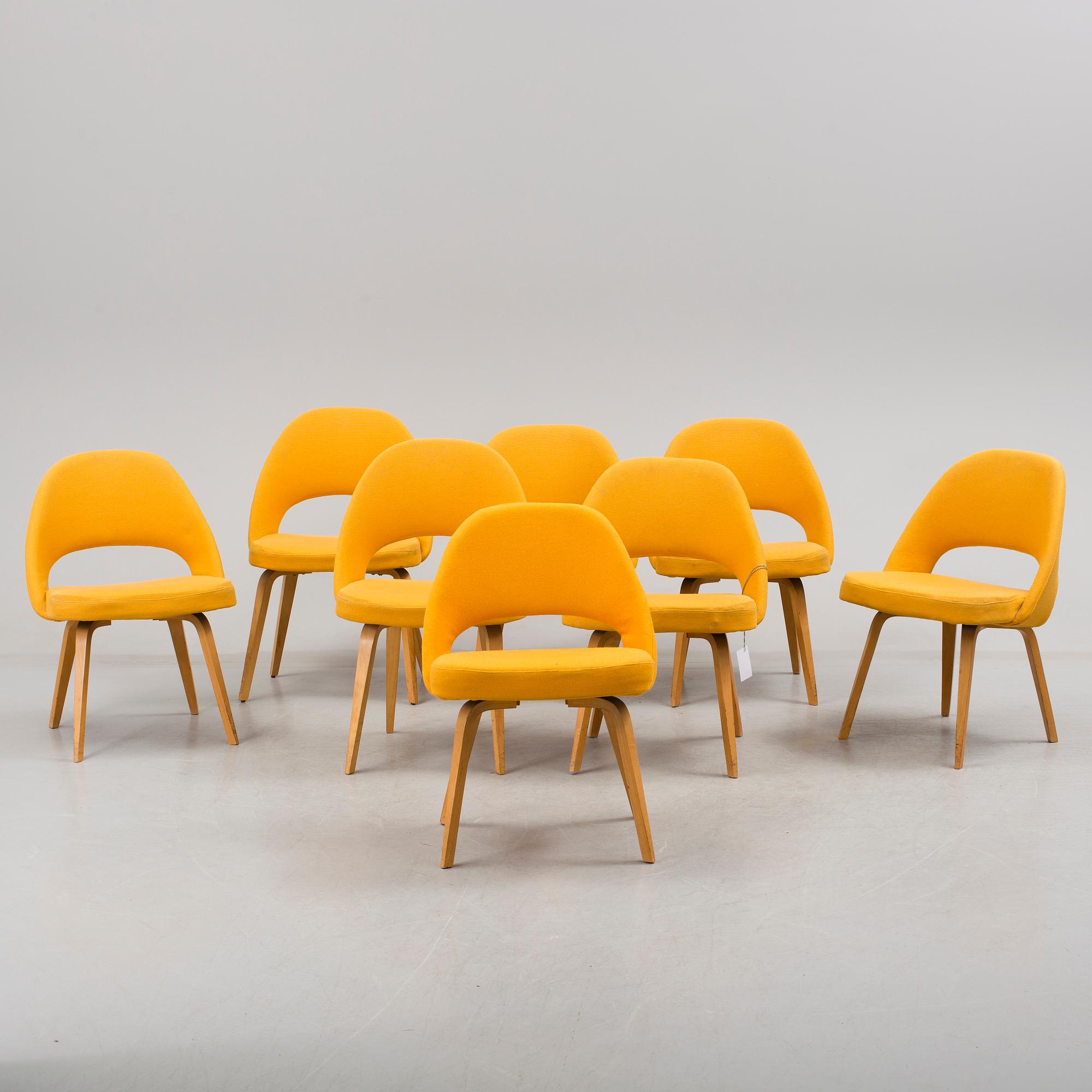 A group eight of Eero Saarinen executive side chair with wood legs, Knoll Products inc.