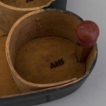 A 19th century folks wooden box in the shape of a loveheart, signed ANS.