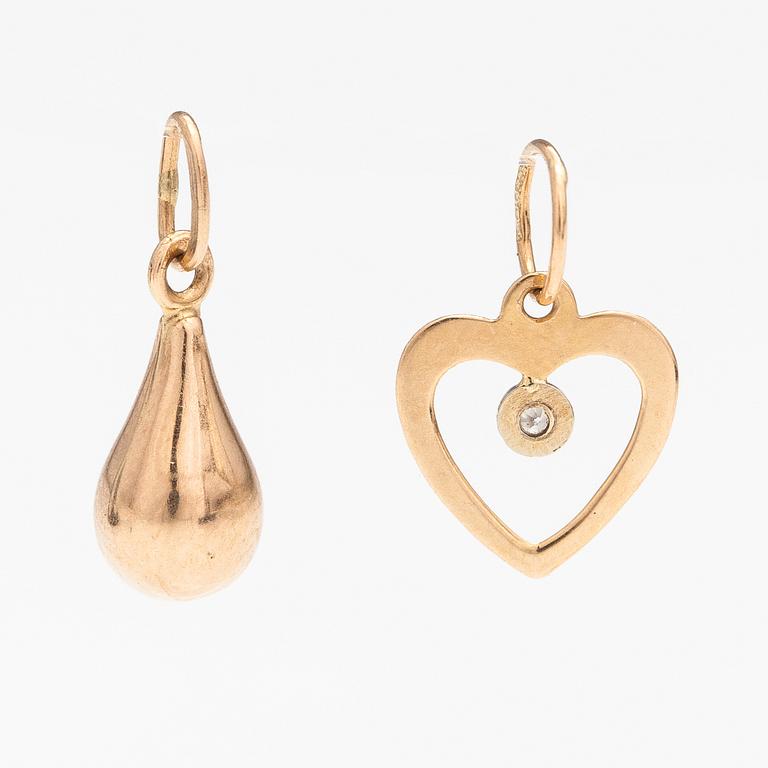 Two 14K gold pendants one with a diamond ca. 0.0025 ct.