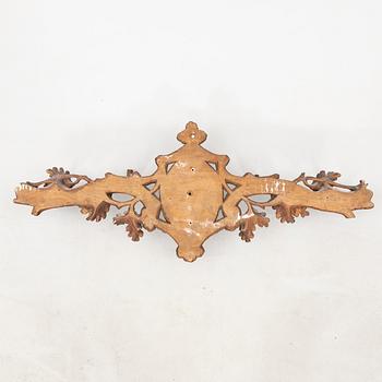 Wall-mounted coat rack dated 1933.