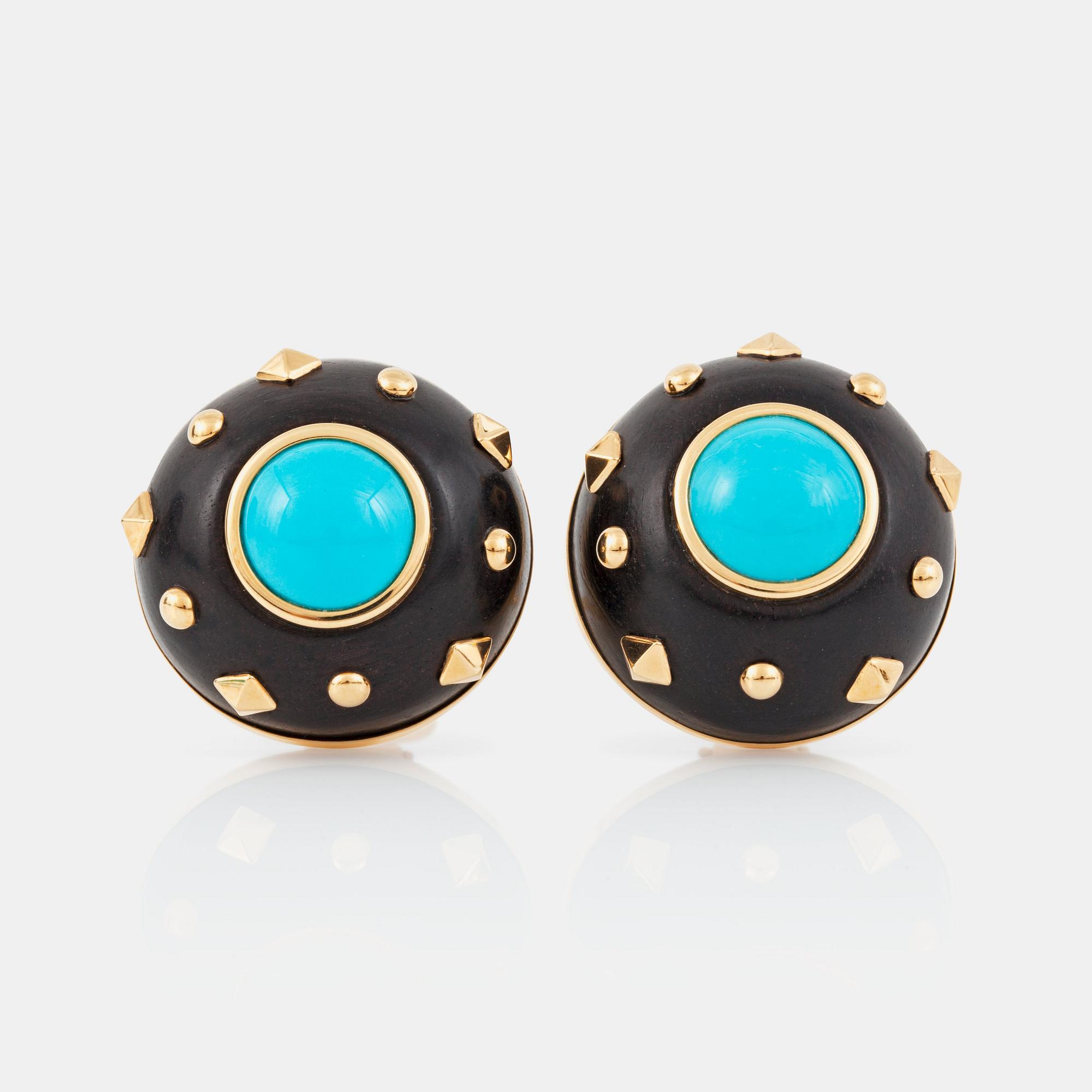 A pair of turquoise and wood earrings by Trianon. No: 27617.